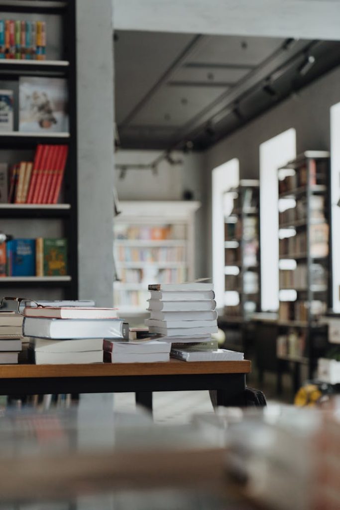 A serene bookshop interior showcasing stacks of books, perfect for reading enthusiasts.